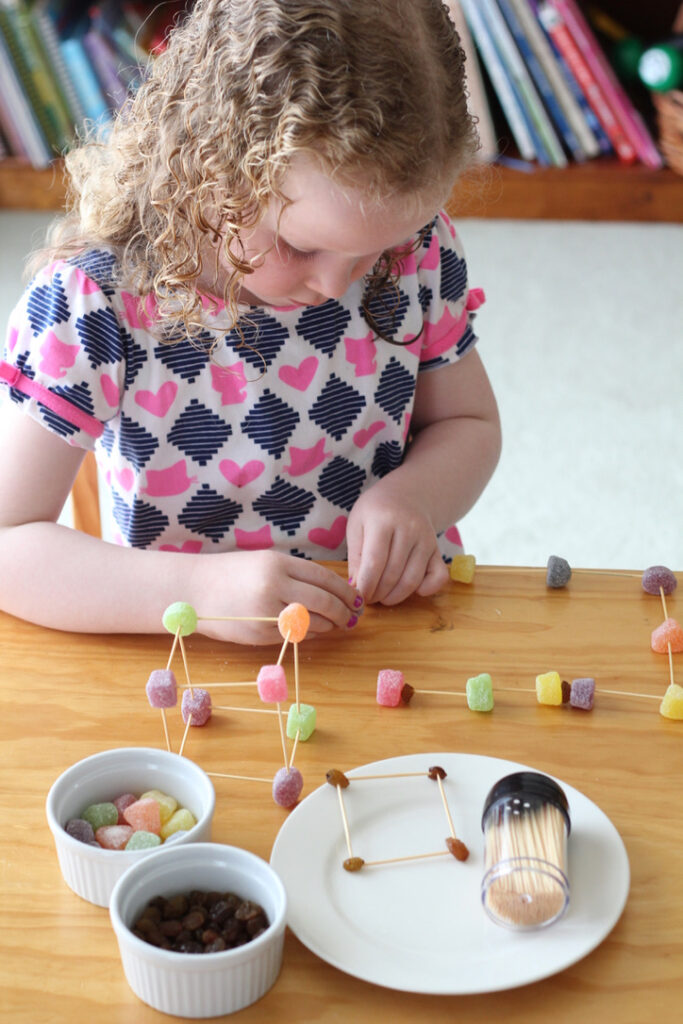 Edible Engineering - child building with lollies and toothpicks