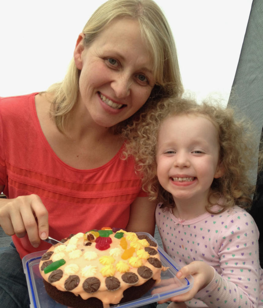 Mother and daughter with birthday cake decorated by child - encouraging creativity