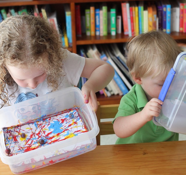 Two children creating Marble Art