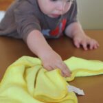 child cleaning bench with a cloth